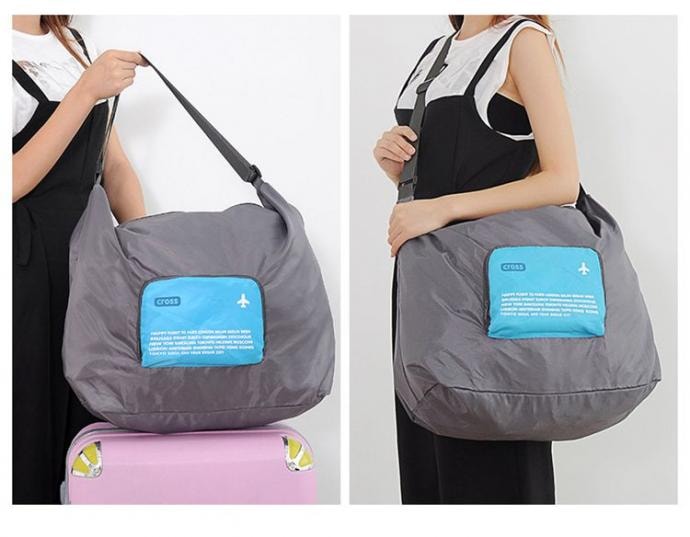 DINIWELL กระเป๋าเดินทางพับเก็บได้ สะพายพาดลำตัวได้ ปรับสายสะพายได้ เสียบที่จับของกระเป๋าเดินทางได้ ผลิตจากโพลีเอสเตอร์กันน้ำ มีซิปรูดตอนพับเก็บ