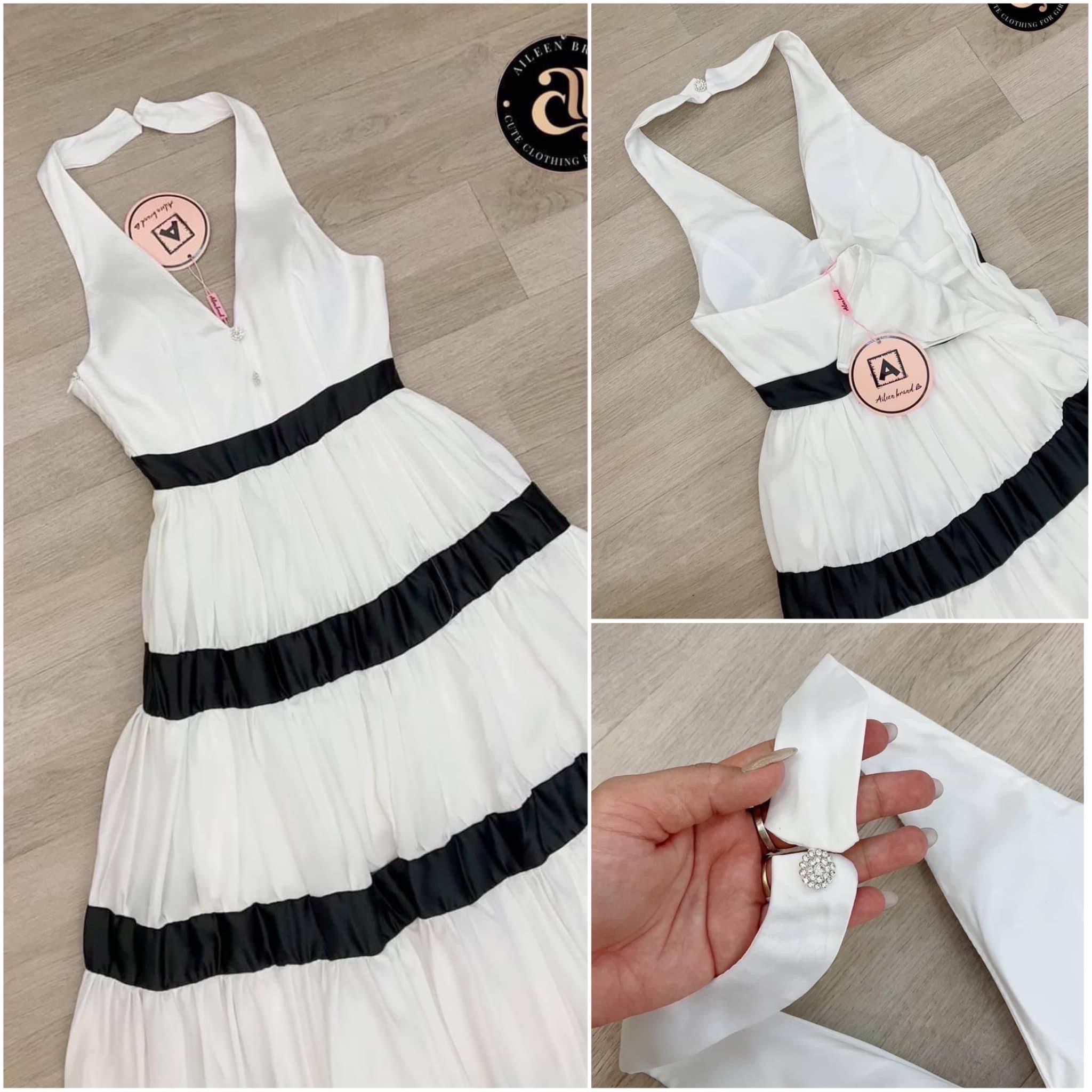 เดรสยาวสีขาว ช่วงอกเนื้อผ้า เรียบมันวาวคอวีแต่งอะไหล่ดอกไม้เพชร ดีไซน์สายคล้องคอมีกระดุมเพชรดอกไม้ ด้านหลังโชว์ครึ่งหลังบน สินค้าคุณภาพ (พร้อมส่ง)