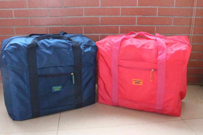 กระเป๋าเดินทางพับเก็บได้ อเนกประสงค์ เพื่อการเดินทาง ท่องเที่ยว เสียบที่จับของกระเป๋าเดินทางได้ (Foldable Travel Duffel Bag Lightweight Waterproof Travel Luggage Bag)